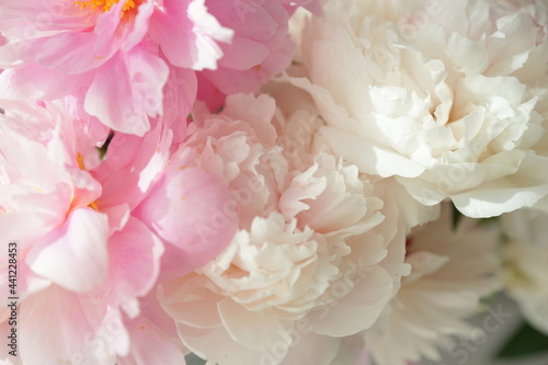 Bouquet of pink peonies on the dresser in the bedroom