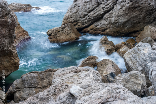 Seascape of the Crimean coast. Waves break into beautiful splashes against rocks. © Андрей Иванов