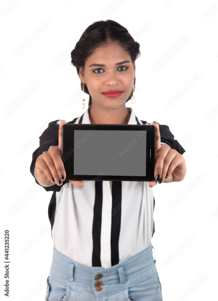 Young beautiful woman holding blank screen smart phone on white background Young beautiful woman holding blank screen smart phone on white background