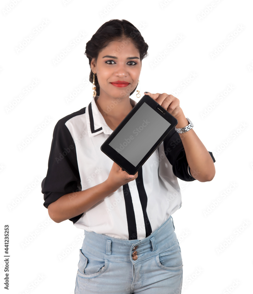 Young beautiful woman holding blank screen smart phone on white background Young beautiful woman holding blank screen smart phone on white background
