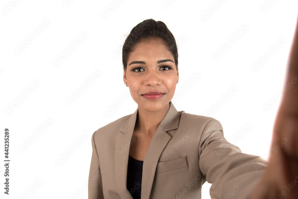 Beautiful young businesswoman using smartphone to take selfie photo isolated on white background Beautiful young businesswoman using smartphone to take selfie photo isolated on white background