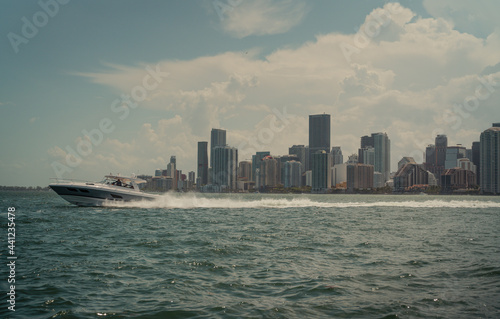 city skyline at sunset boat life lifestyle beautiful panoramic Miami Florida usa travel vacation ocean blue clouds 