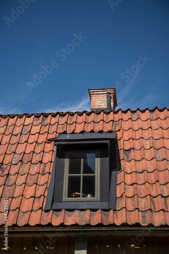 Roof with dormer and chimney on an old 1700s house in Stockholm