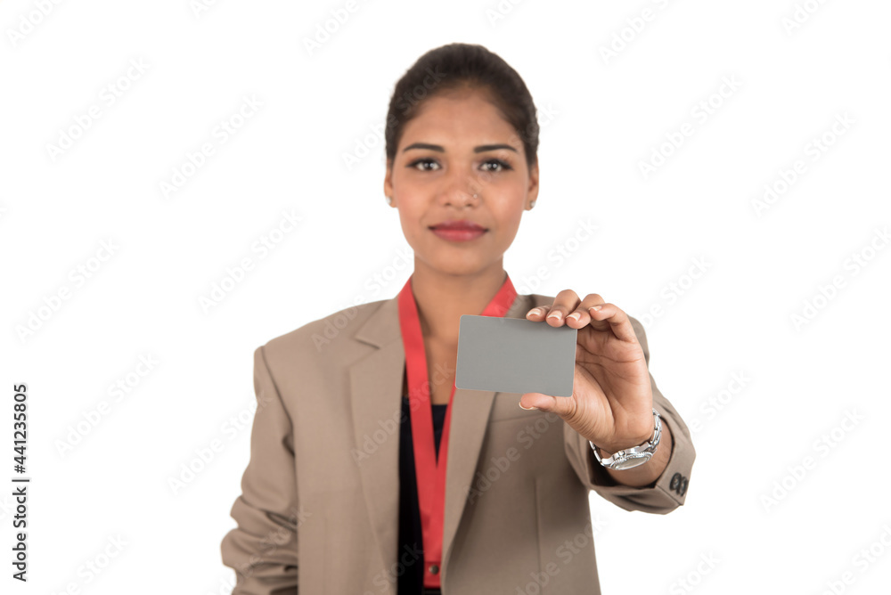 Smiling business woman holding a blank business card or ID card over white background Smiling business woman holding a blank business card or ID card over white background