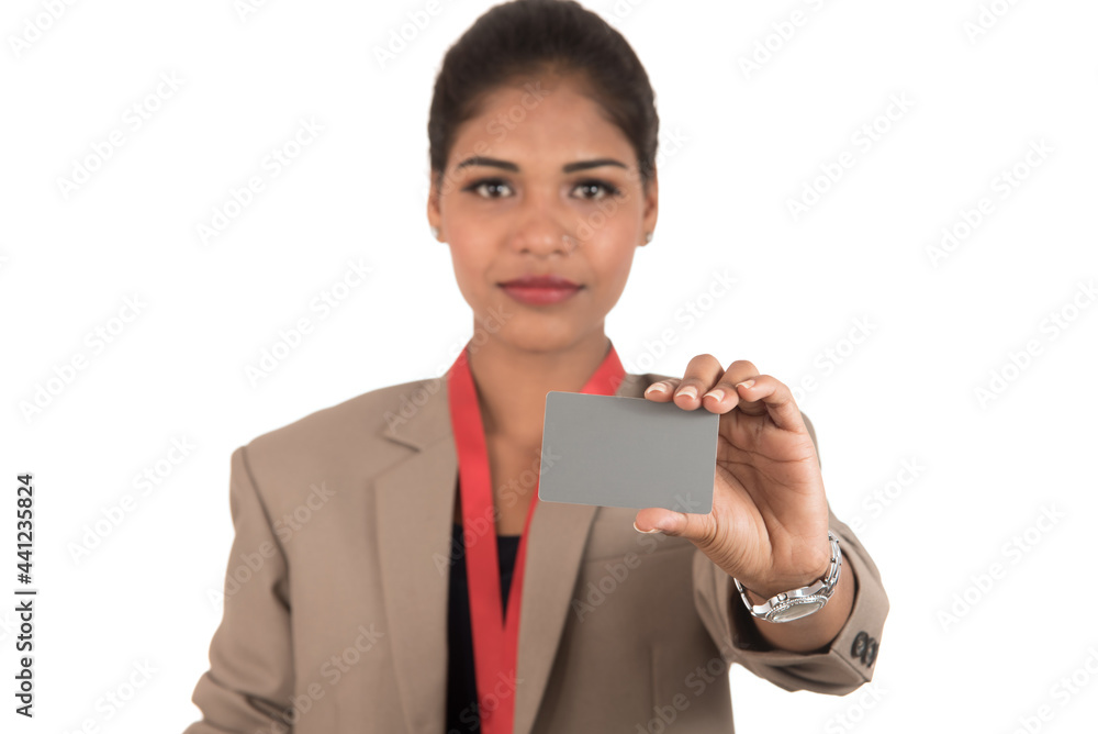 Smiling business woman holding a blank business card or ID card over white background Smiling business woman holding a blank business card or ID card over white background