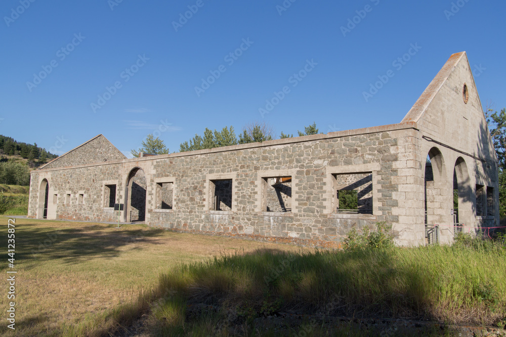 the outer shell of a stone building with windows