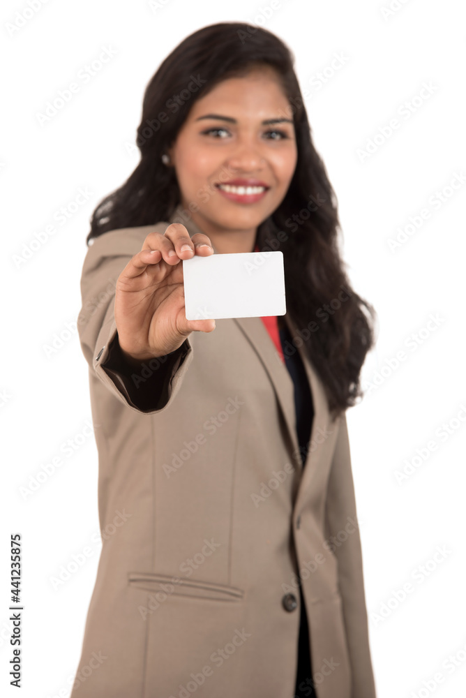 Smiling business woman holding a blank business card or ID card over white background Smiling business woman holding a blank business card or ID card over white background