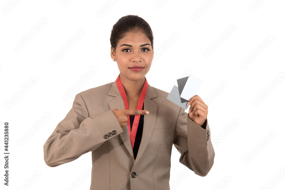 Smiling business woman holding a blank business card or ID card over white background Smiling business woman holding a blank business card or ID card over white background