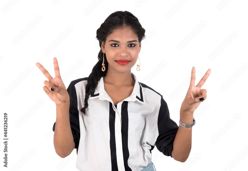 Portrait of beautiful young smiling girl posing on white background Portrait of beautiful young smiling girl posing on white background