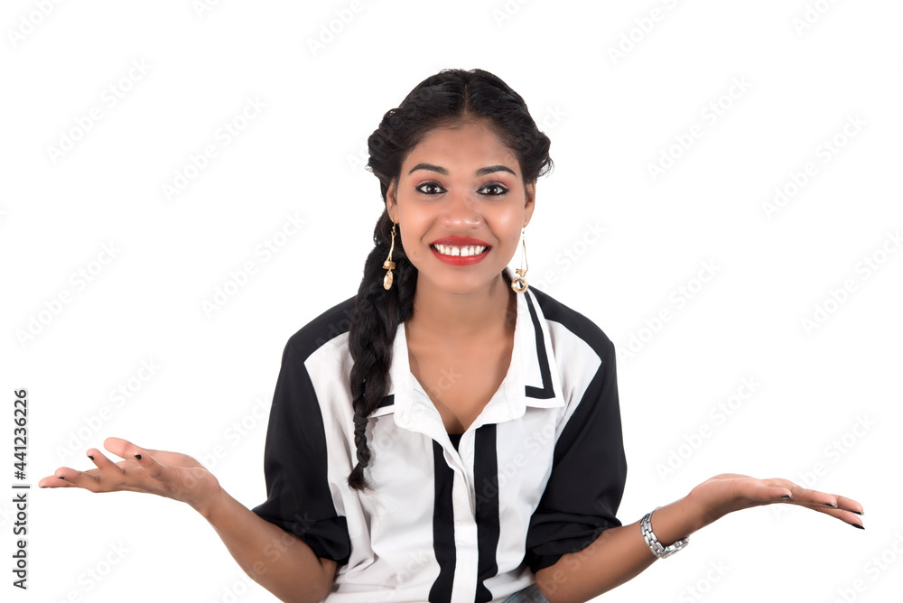 Portrait of beautiful young smiling girl posing on white background Portrait of beautiful young smiling girl posing on white background
