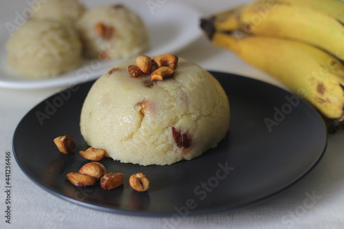 Semolina banana pudding. A fluffy Indian pudding made of Semolina, ghee, sugar, bananas and garnished with cashews. Locally known as banana sheera. photo