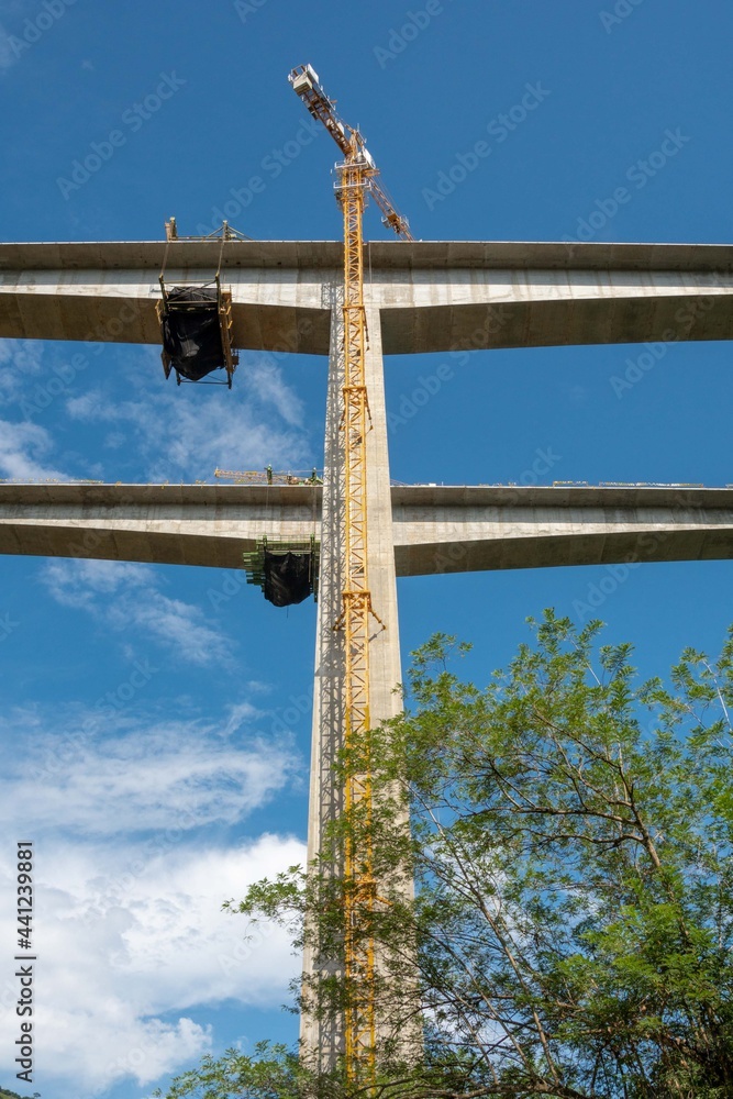 Landscape with infrastructure of a bridge in southwest Antioquia and blue sky.