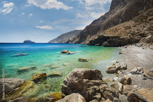 View of the beach below the cliff on the south coast of the Greek island of Amorgos in the Cyclades archipelago