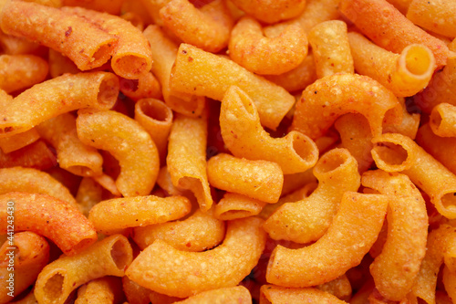 Close up of a pile of macaroni. Background of Pile of pasta
