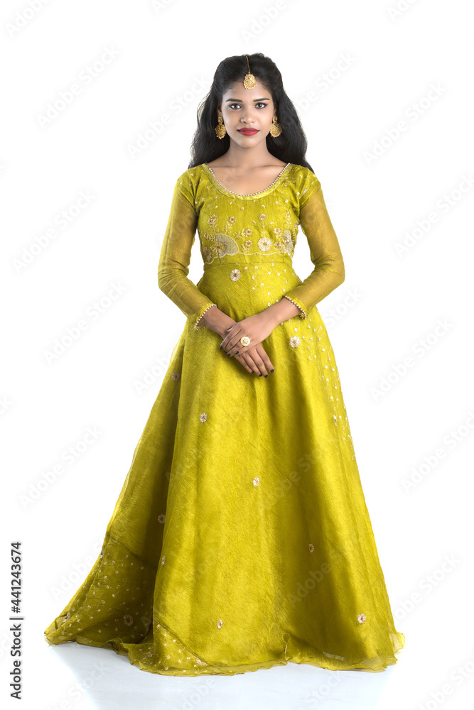 Portrait of beautiful traditional Indian girl posing on white background. Portrait of beautiful traditional Indian girl posing on white background.