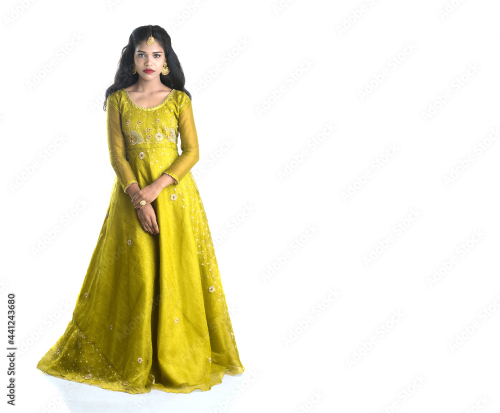 Portrait of beautiful traditional Indian girl posing on white background. Portrait of beautiful traditional Indian girl posing on white background.