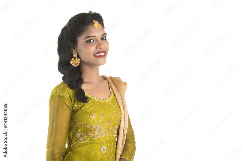 Portrait of beautiful traditional Indian girl posing on white background. Portrait of beautiful traditional Indian girl posing on white background.