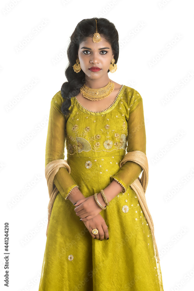 Portrait of beautiful traditional Indian girl posing on white background. Portrait of beautiful traditional Indian girl posing on white background.