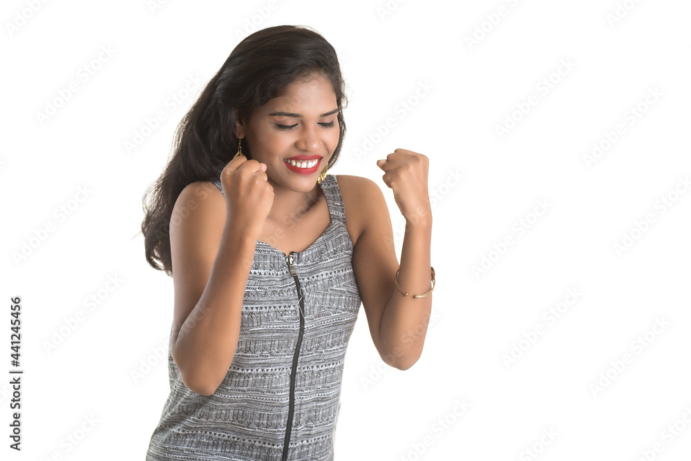 Smiling cheerful girl showing sign isolated on white background Smiling cheerful girl showing sign isolated on white background