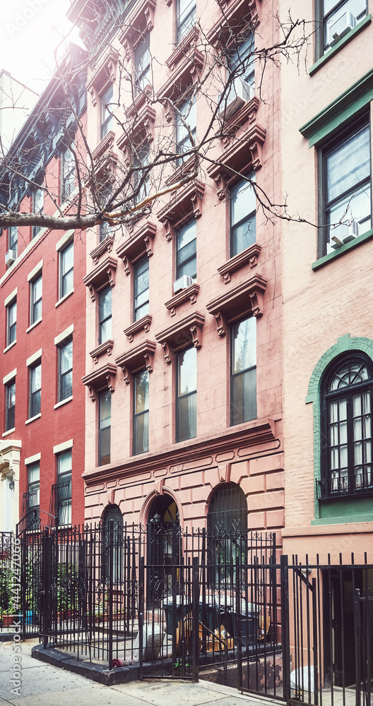 Old townhouses in Manhattan, color toning applied, New York, USA.