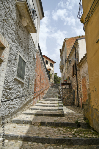 Fototapeta Naklejka Na Ścianę i Meble -  A small street between the old houses of Deliceto, a medieval village in the mountains of the Pugliaregion.