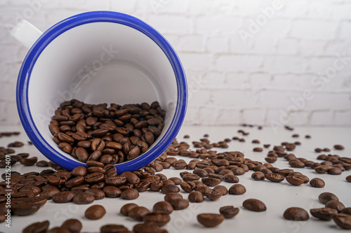 coffee beans in white glass white brick background scene