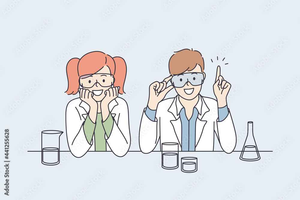 Laboratory research and tests for kids concept. Smiling happy small boy and girl children cartoon characters in white uniform sitting and making research tests with flasks together making innovations Laboratory research and tests for kids concept. Smiling happy small boy and girl children cartoon characters in white uniform sitting and making research tests with flasks together making innovations