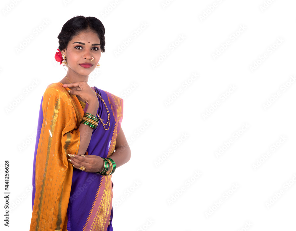 Beautiful Indian young girl posing in traditional Indian saree on white background. Beautiful Indian young girl posing in traditional Indian saree on white background.