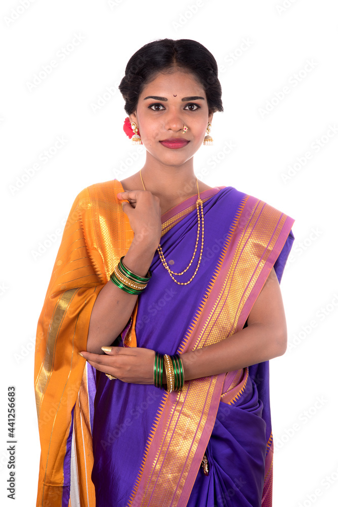 Beautiful Indian young girl posing in traditional Indian saree on white background. Beautiful Indian young girl posing in traditional Indian saree on white background.