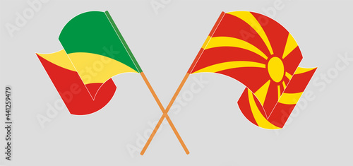 Crossed and waving flags of Republic of the Congo and North Macedonia