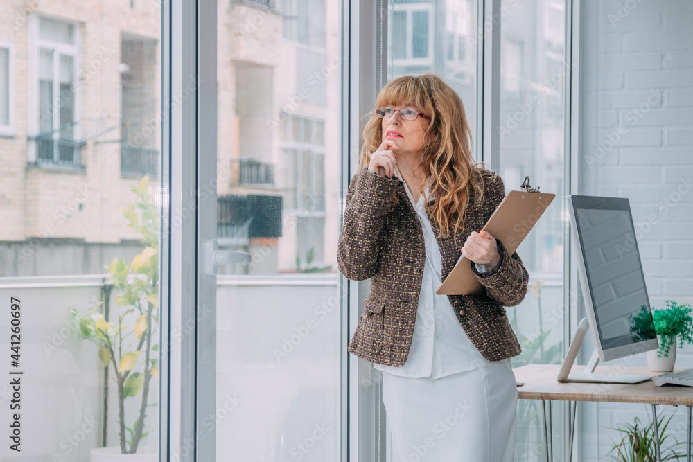 business woman with documents in office business woman with documents in office