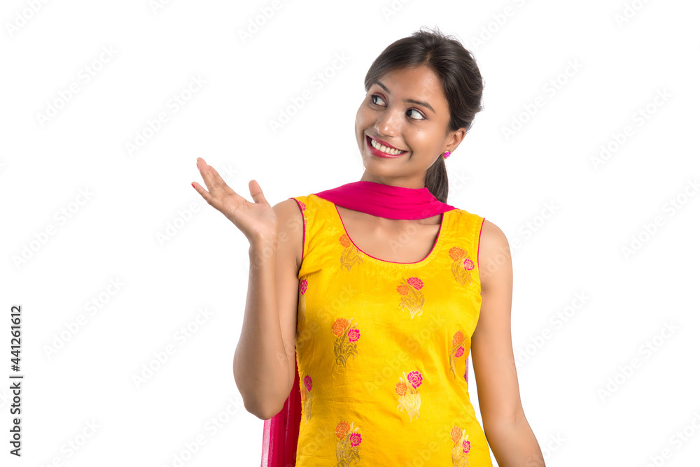 Beautiful Indian traditional girl posing on white background. Beautiful Indian traditional girl posing on white background.