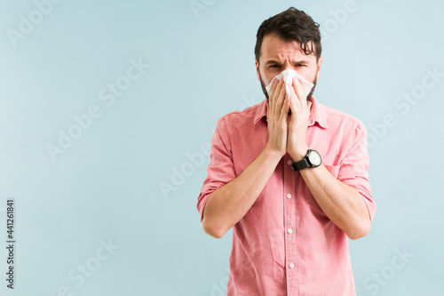 Attractive young man sick with a bad flu