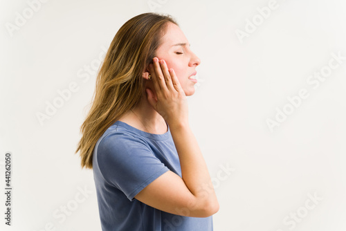 Side view of a woman with tinnitus photo