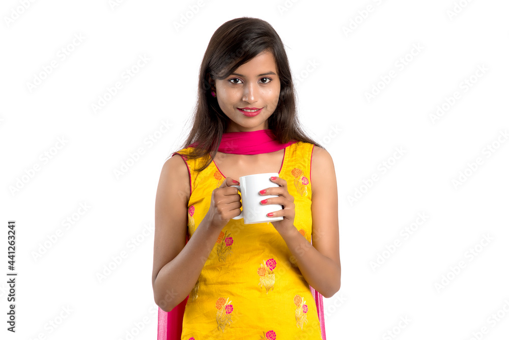 pretty young girl with cup of tea or coffee posing on white background pretty young girl with cup of tea or coffee posing on white background