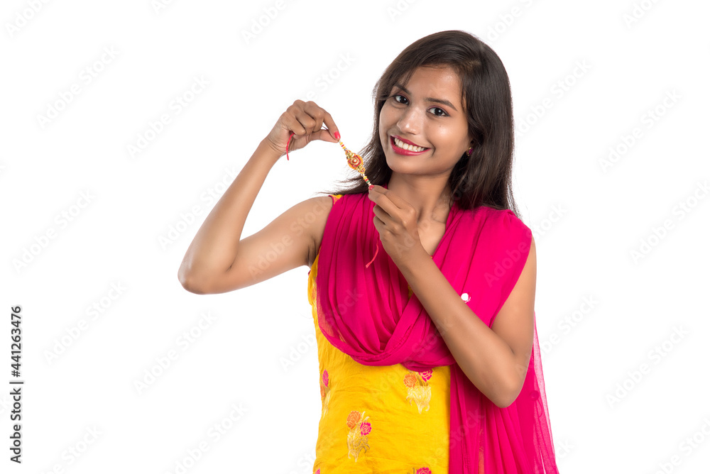 Beautiful Indian girl showing Rakhis on occasion of Raksha bandhan. Sister tie Rakhi as symbol of intense love for her brother. Beautiful Indian girl showing Rakhis on occasion of Raksha bandhan. Sister tie Rakhi as symbol of intense love for her brother.