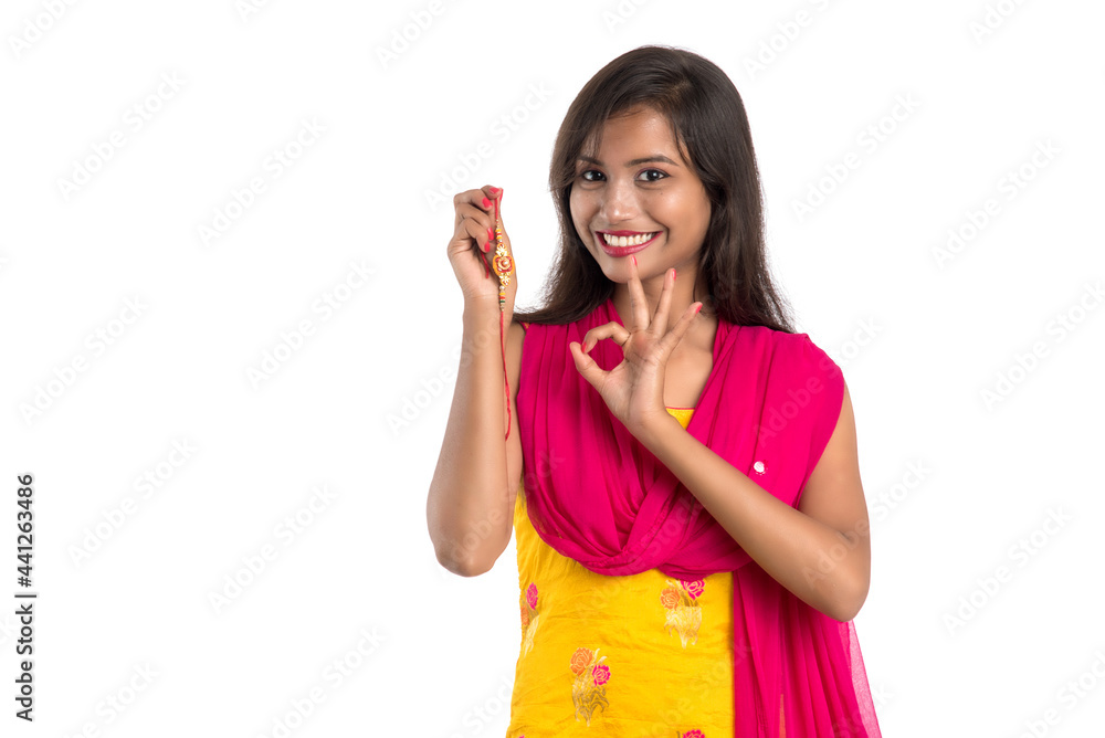 Beautiful Indian girl showing Rakhis on occasion of Raksha bandhan. Sister tie Rakhi as symbol of intense love for her brother. Beautiful Indian girl showing Rakhis on occasion of Raksha bandhan. Sister tie Rakhi as symbol of intense love for her brother.