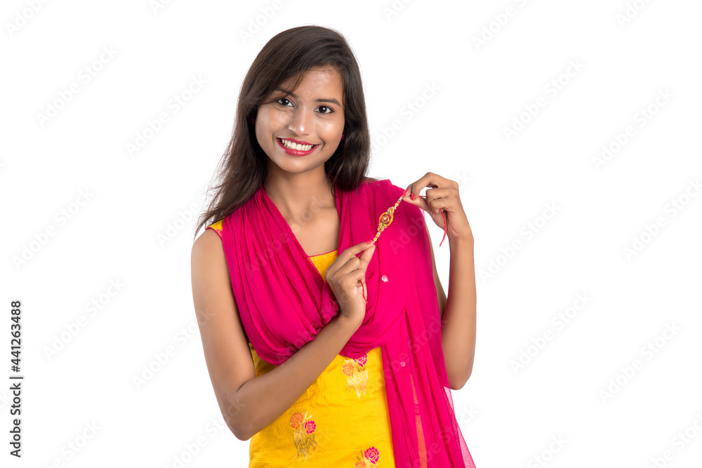 Beautiful Indian girl showing Rakhis on occasion of Raksha bandhan. Sister tie Rakhi as symbol of intense love for her brother. Beautiful Indian girl showing Rakhis on occasion of Raksha bandhan. Sister tie Rakhi as symbol of intense love for her brother.