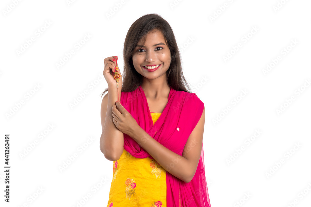Beautiful Indian girl showing Rakhis on occasion of Raksha bandhan. Sister tie Rakhi as symbol of intense love for her brother. Beautiful Indian girl showing Rakhis on occasion of Raksha bandhan. Sister tie Rakhi as symbol of intense love for her brother.