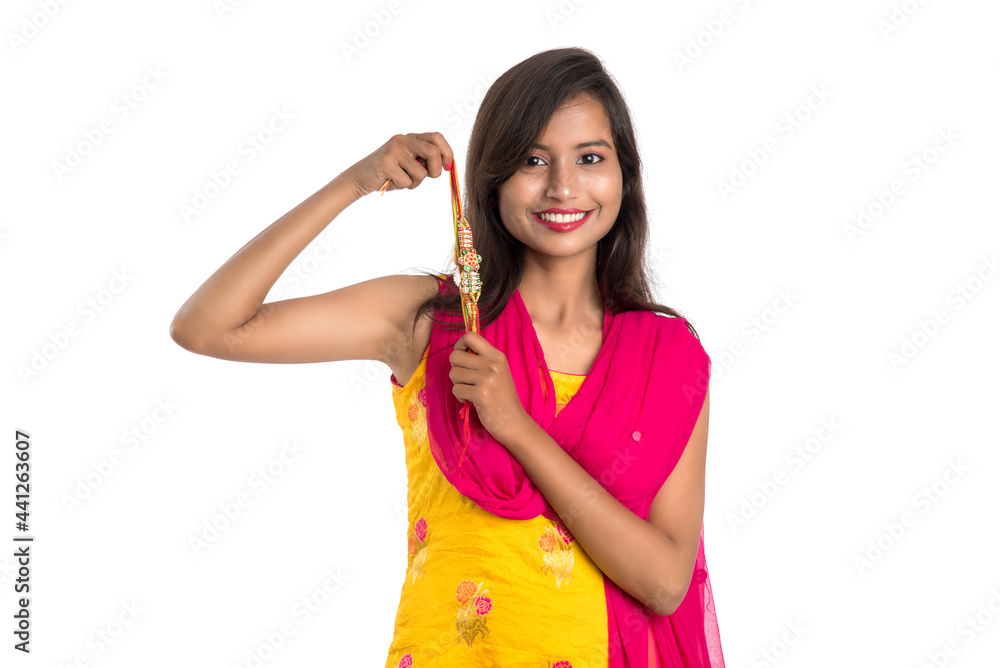 Beautiful Indian girl showing Rakhis on occasion of Raksha bandhan. Sister tie Rakhi as symbol of intense love for her brother. Beautiful Indian girl showing Rakhis on occasion of Raksha bandhan. Sister tie Rakhi as symbol of intense love for her brother.