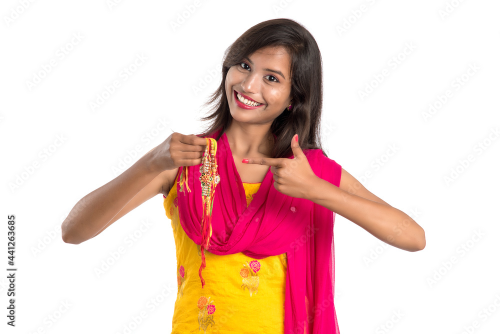 Beautiful Indian girl showing Rakhis on occasion of Raksha bandhan. Sister tie Rakhi as symbol of intense love for her brother. Beautiful Indian girl showing Rakhis on occasion of Raksha bandhan. Sister tie Rakhi as symbol of intense love for her brother.