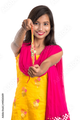 Beautiful Indian girl showing Rakhis on occasion of Raksha bandhan. Sister tie Rakhi as symbol of intense love for her brother.