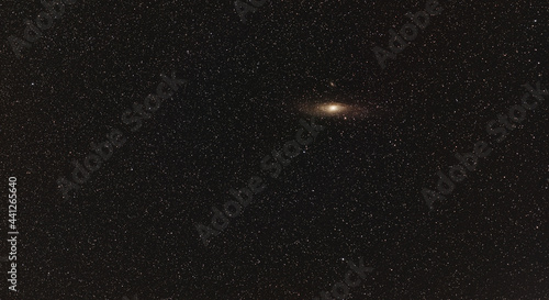 Night sky, many stars, Andromeda galaxy visible. Long exposure stacked photo photo