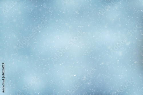 Snowfall texture of snowflakes on blurry background design weather © Serenkonata