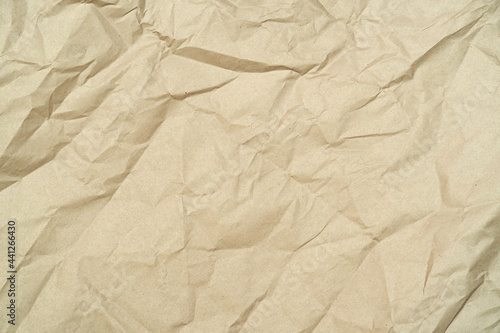 wrinkled, crumpled, brown craft recycled paper, cardboard as background