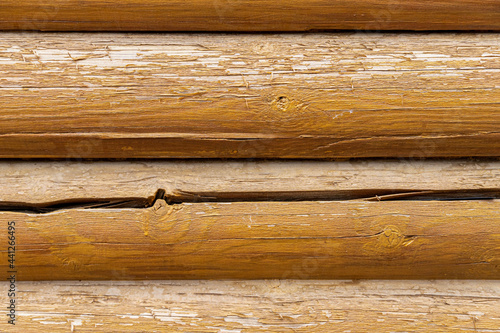 Background from old wooden logs with cracked paint