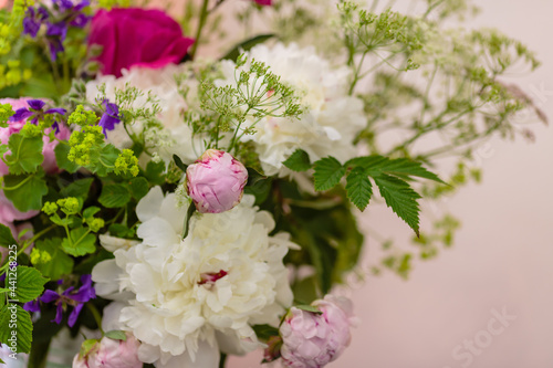 Beautiful peonies in a bouquet. Peonies in floristry. © Flower_Garden