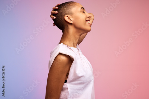 фотографія Androgynous woman standing against background