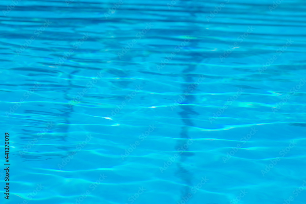 blurred reflection in blue water in the pool, natural background, texture blurred reflection in blue water in the pool, natural background, texture
