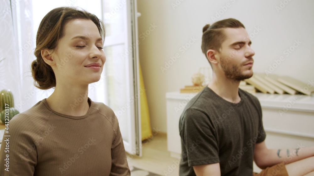 Two sporty friends are meditating and speaking to each other Two sporty friends are meditating and speaking to each other